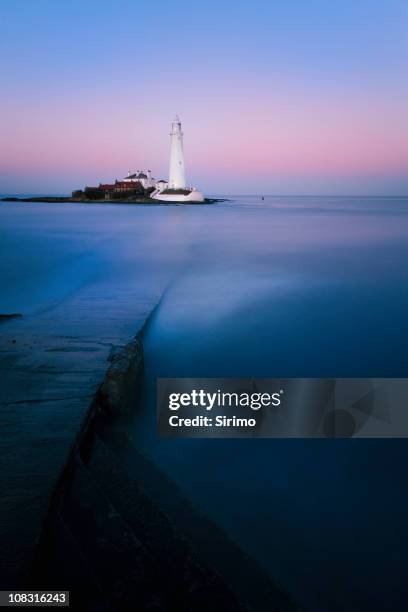 st mary's lighthouse sunset long exposure - whitley bay stock pictures, royalty-free photos & images