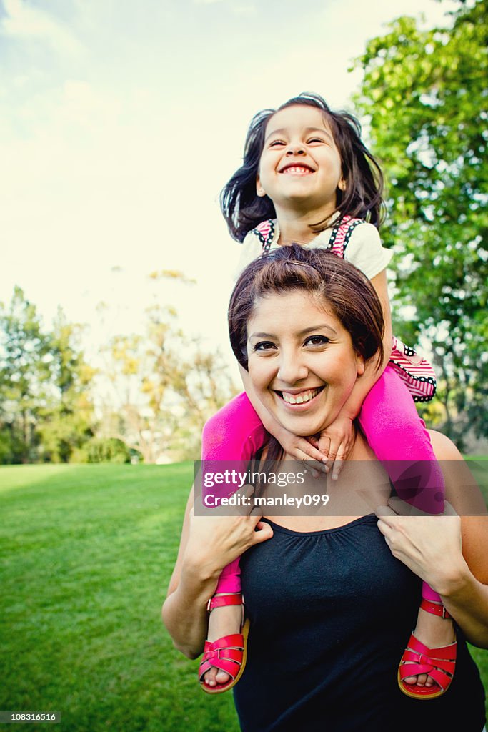 Having an awesome time on mom's shoulder