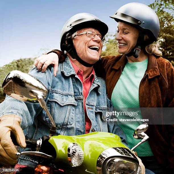 seniors riding scooter - old motorcycles bildbanksfoton och bilder