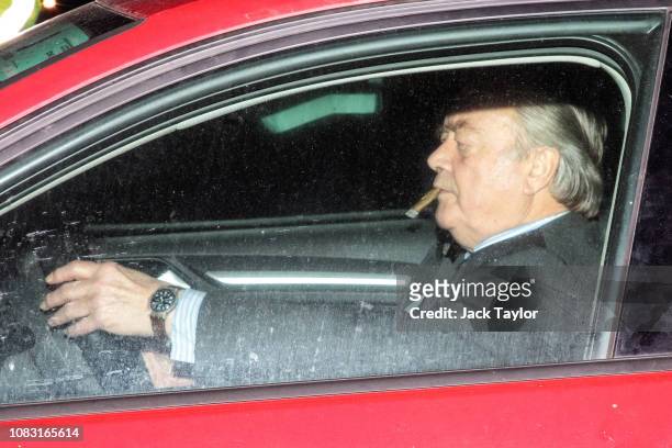 British Conservative politician and Father of the House of Commons Ken Clarke smokes a cigar as he leaves the House of Commons following the...