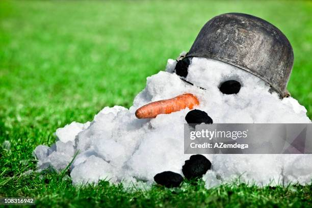 coming spring - melting snowman stock pictures, royalty-free photos & images