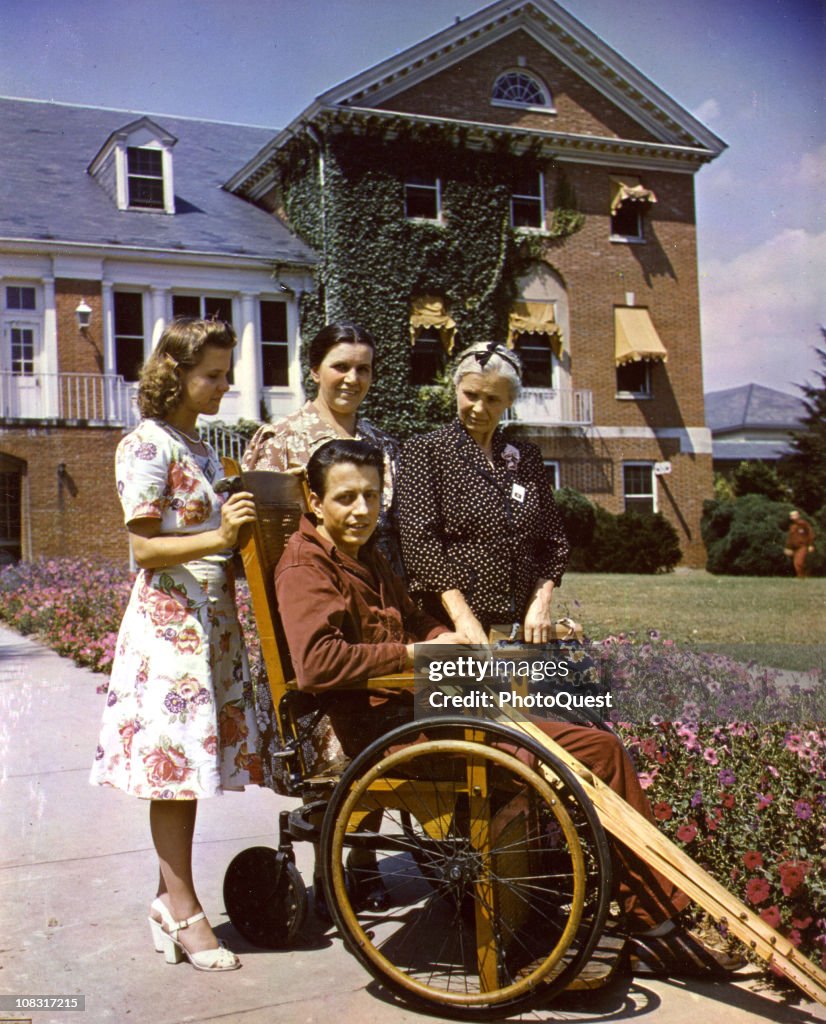 Visiting Walter Reed A patient in a wheelchair is shown with his visiting family at Walter ...