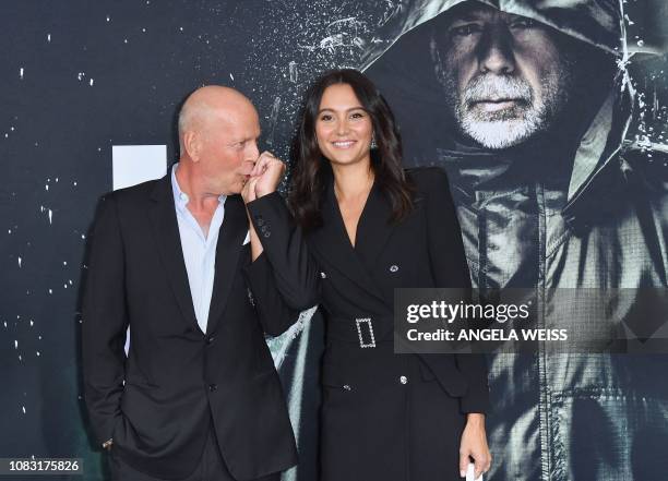 Actor Bruce Willis and his wife English model Emma Heming attend the premiere of Universal Pictures' "Glass" at SVA Theatre on January 15, 2019 in...
