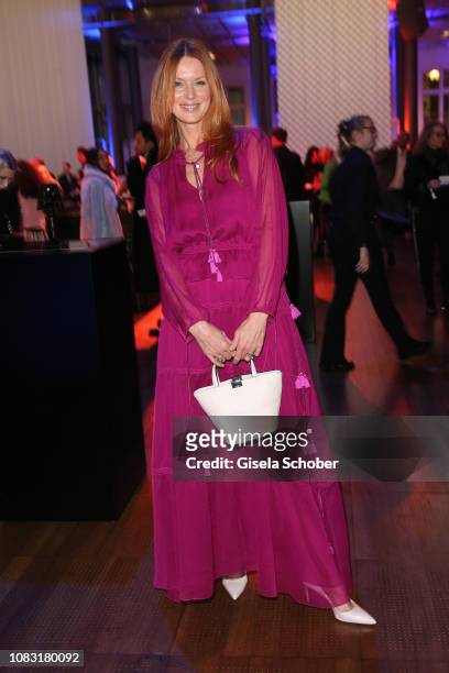 Esther Schweins wearing a purple dress by Marc Cain during the Marc Cain Fashion Show Autumn/Winter 2019 at Deutsche Telekom's representative office...