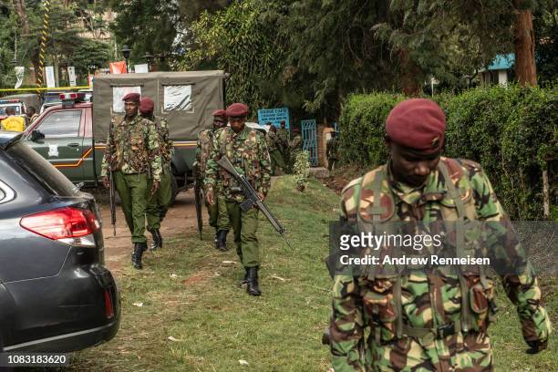 Kenyan security forces walk outside the Dusit Hotel on January 16, 2018 in Nairobi, Kenya. A security operation has continued into a second day after...