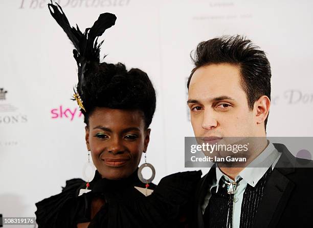 Singer Shingai Shoniwa and musician Dan Smith of the Noisettes pose in the press room at the South Bank Sky Arts Awards at The Dorchester on January...