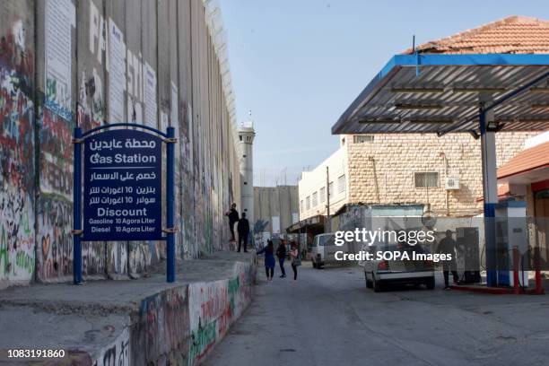 Fuel station seen next to the Separation Wall. The Israeli Separation Wall is a dividing barrier that separates the West Bank from Israel.