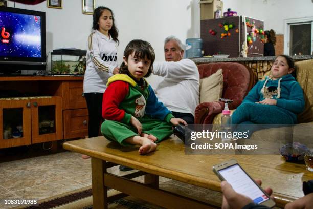 Palestinian family seen at their home in Dheisheh Refugee Camp.