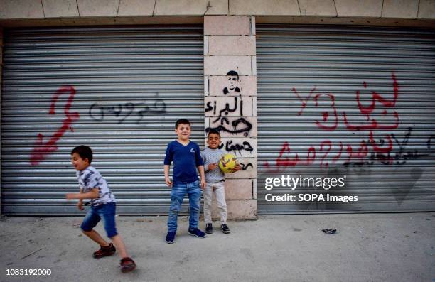 Children are seen playing on the street at the Dheisheh Refugee Camp.