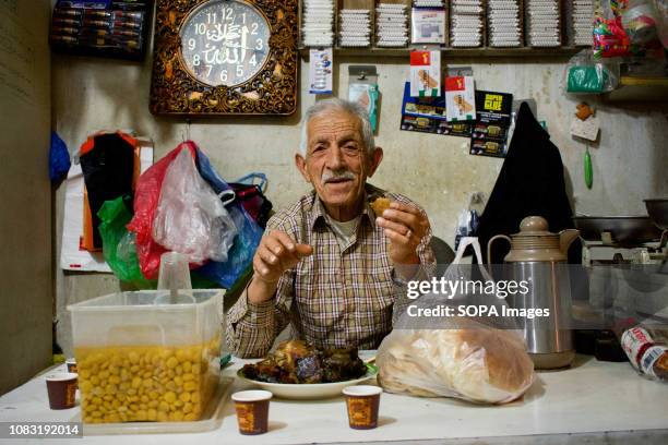 Palestinian refugee seen at his shop in the Dheisheh Refugee Camp.