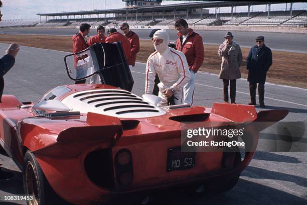 Mario Andretti prepares to take over the wheel of his Ferrari 512S during the running of the 24 Hours of Daytona at Daytona International Speedway....