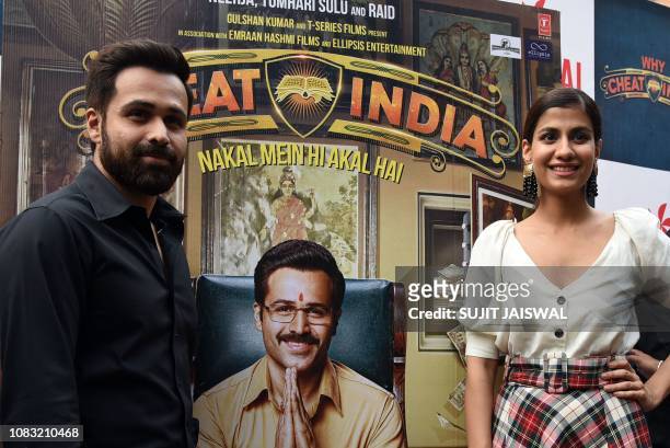 Indian Bollywood actors Emraan Hashmi and Shreya Dhanwanthary pose during the promotion of the upcoming comedy drama Hindi film 'Why Cheat India' at...