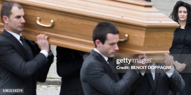 Hereditary Grand Duchess Stephanie of Luxembourg looks on as men carry the coffin at the funeral service for Count Philippe de Lannoy, at...