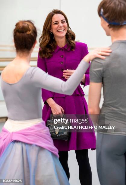 Britain's Catherine, Duchess of Cambridge, watches Royal Ballet Principal Dancers Lauren Cuthbertson and Vadim Muntagirov during a visit to the Royal...