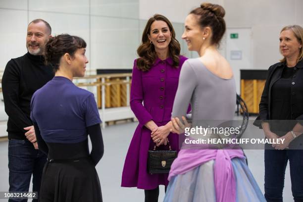 Britain's Catherine, Duchess of Cambridge, talks with Royal Ballet Principal Dancers Laura Morera and Lauren Cuthbertson during a visit to the Royal...