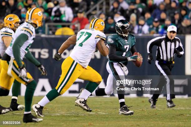 Michael Vick of the Philadelphia Eagles scrambles against the Green Bay Packers during the 2011 NFC wild card playoff game at Lincoln Financial Field...