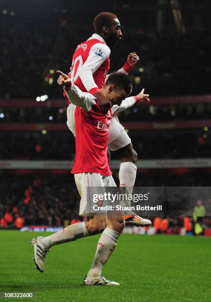 Laurent Koscielny of Arsenal celebrates with Johan Djourou as he scores their second goal during the Carling Cup Semi Final Second Leg match between...