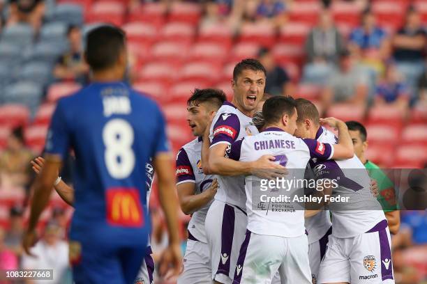 Neil Kilkenny of Perth Glory celebrates his goal with team mates during the round eight A-League match between the Newcastle Jets and the Perth Glory...
