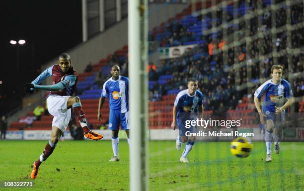 Ashley Young of Aston Villa scores a penalty to make it 2-0 during the Barclays Premier League match between Wigan Athletic and Aston Villa at the DW...