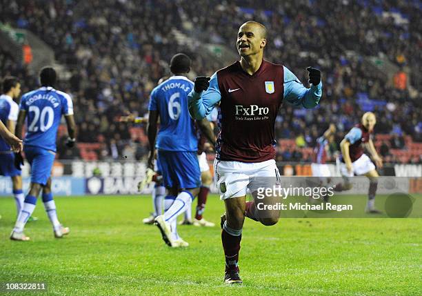 Gabriel Agbonlahor of Villa celebrates scoring the first goal during the Barclays Premier League match between Wigan Athletic and Aston Villa at the...