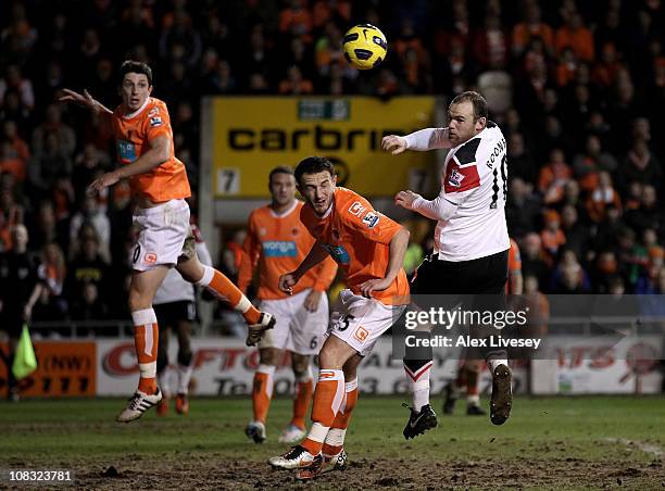 Wayne Rooney of Manchester United goes up for a header during the Barclays Premier League match between Blackpool and Manchester United at Bloomfield...