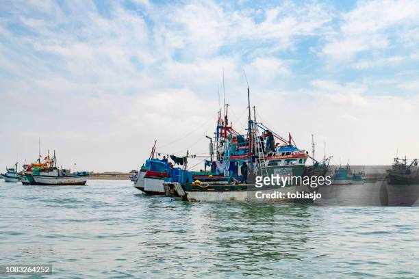 fishing boat at paracas harbor - pisco peru stock pictures, royalty-free photos & images
