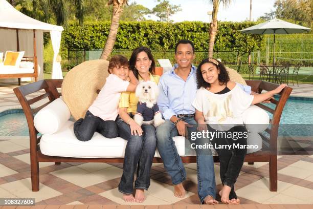 Jon Secada poses with his wife Maritere and their children Mikaela, Nina and Jon Henri for an exclusive at home photo shoot on January 13, 2011 in...