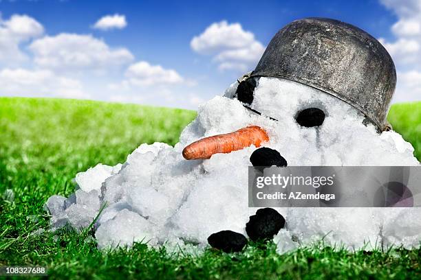coming spring - melting snowman stock pictures, royalty-free photos & images