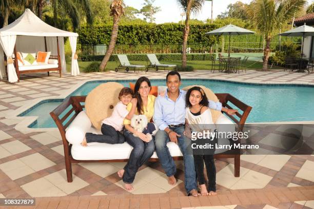 Jon Secada poses with his wife Maritere and their children Mikaela, Nina and Jon Henri for an exclusive at home photo shoot on January 13, 2011 in...