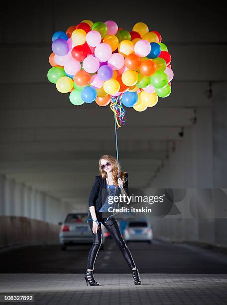 woman holding many balloons - different car models stock pictures, royalty-free photos & images