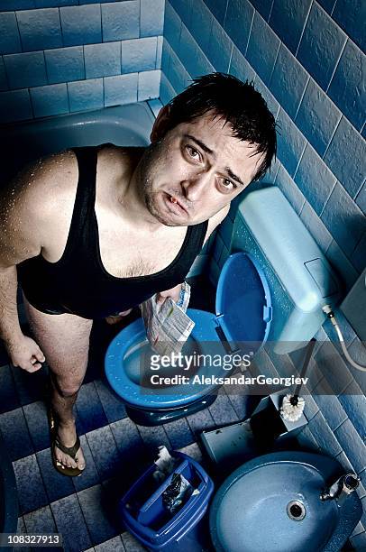 wet man smoking in toilet - ugly people crying stock pictures, royalty-free photos & images