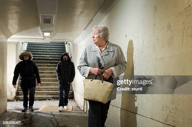 subway threat - boy looking over shoulder stock pictures, royalty-free photos & images