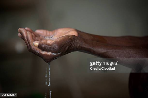 handful of water - haiti poverty stock pictures, royalty-free photos & images