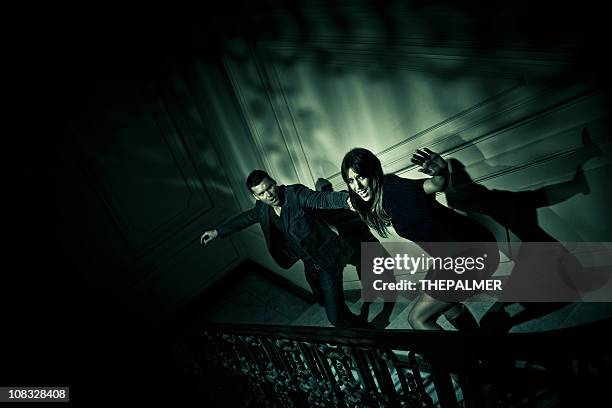 couple escaping from evil - cannes city stock pictures, royalty-free photos & images