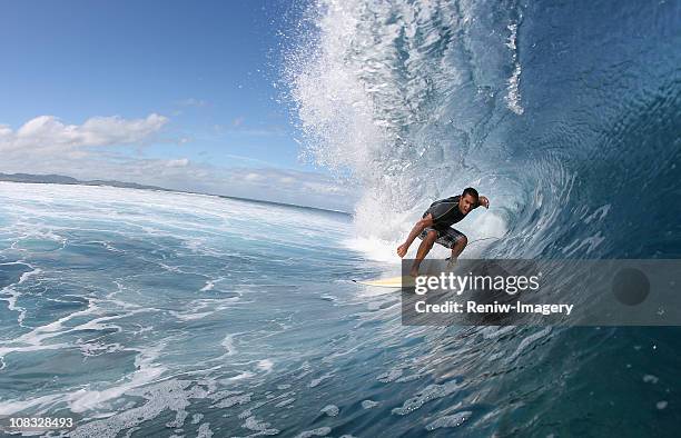 surfer inside a wave - fiji people stock pictures, royalty-free photos & images