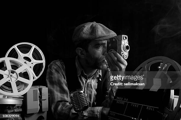 portrait of old fashioned cinema director camera in hand - film festival stock pictures, royalty-free photos & images