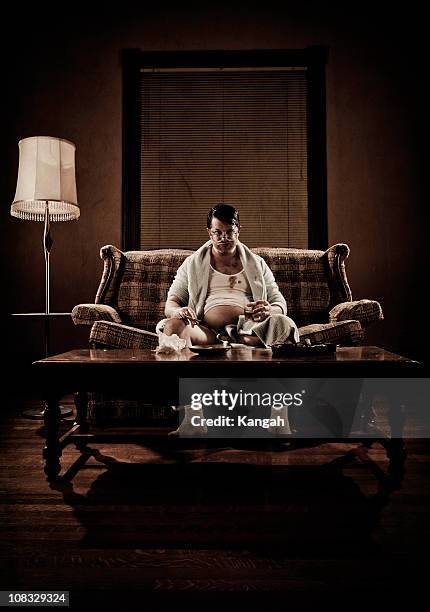 1970s white trash - fat man sitting stock pictures, royalty-free photos & images