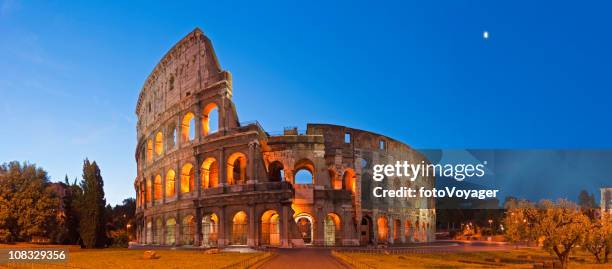 rome coliseum colosseo ancient roman amphitheatre italy panorama blue moon - palatine hill stock pictures, royalty-free photos & images