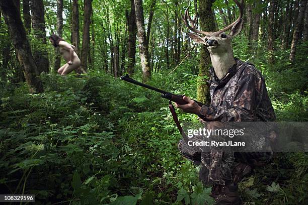 role reversal deer hunter - jagende dieren stockfoto's en -beelden