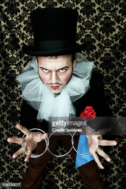 theatrical magician ring trick - pro con stock pictures, royalty-free photos & images