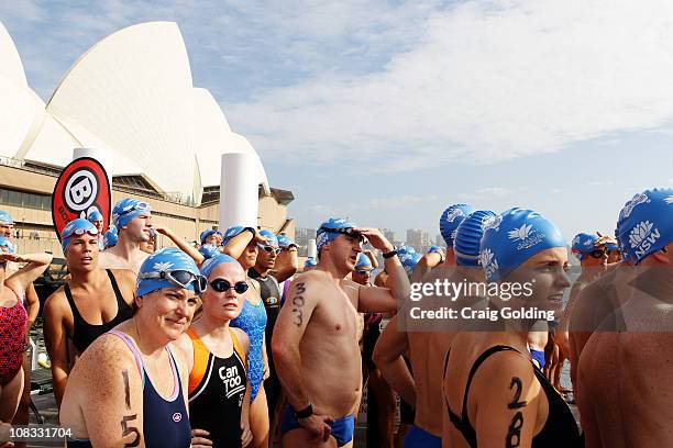 Swimmers make their way to the start area of the Body Science Great Australian Swim Series at the Sydney Harbour on January 26, 2011 in Sydney,...