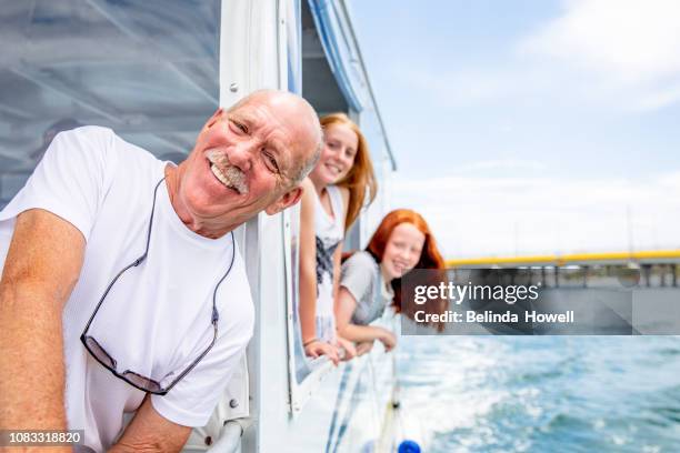 australian family enjoys a weekend out on a boat on the gold coast with their friends and children - pontoon boat stock pictures, royalty-free photos & images