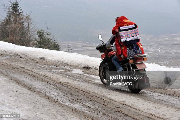 Mirgrant worker rides home to Gaopo town on January 25, 2011 in Guiyang, Guizhou province of China. Chinese are on the move in the world's biggest...