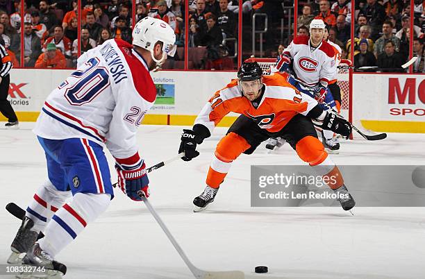 Blair Betts of the Philadelphia Flyers defends against an attempted shot by James Wisniewski of the Montreal Canadiens on January 25, 2011 at the...