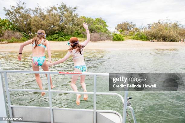 australian family spends the weekend on a boat, enjoying each others company. - pontoon boat stock pictures, royalty-free photos & images
