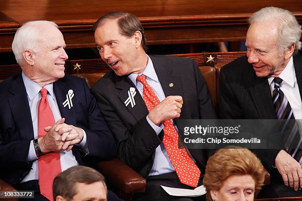 Sen. John McCain , Sen. Mark Udall and Sen. Joe Lieberman talk before U.S. President Barack Obama's State of the Union address on Capitol Hill on...