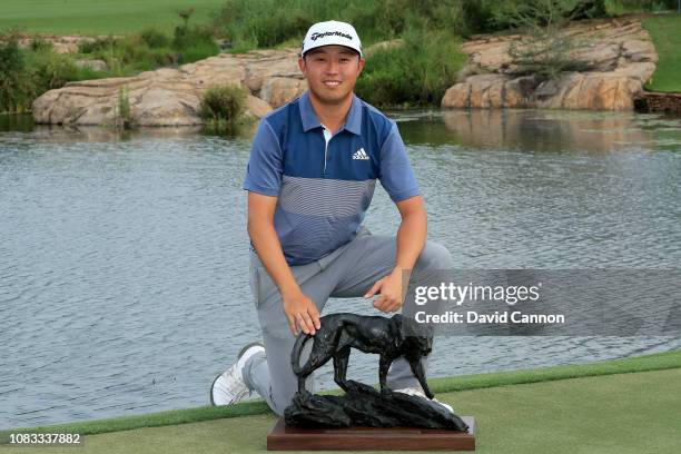 David Lipsky of the United States holds the trophy after his two shot win in the final round of the Alfred Dunhill Championships at Leopard Creek...
