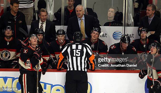 Head coach Joel Quenneville of the Chicago Blackhawks argues with referee Stephane Auger after a goal against the Minnesota Wild was waved off as...
