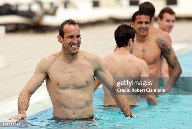 Mark Schwarzer stretches in the pool during an Australian Socceroos recovery session at the Marriott Hotel on January 26, 2011 in Doha, Qatar.