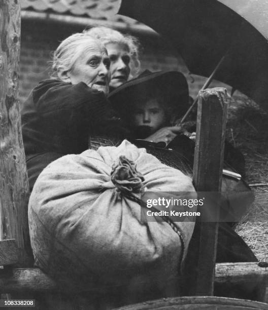 Dutch refugees on a horse-drawn cart after being ordered to leave the town of Kerkrade, Netherlands, 25th September 1944.